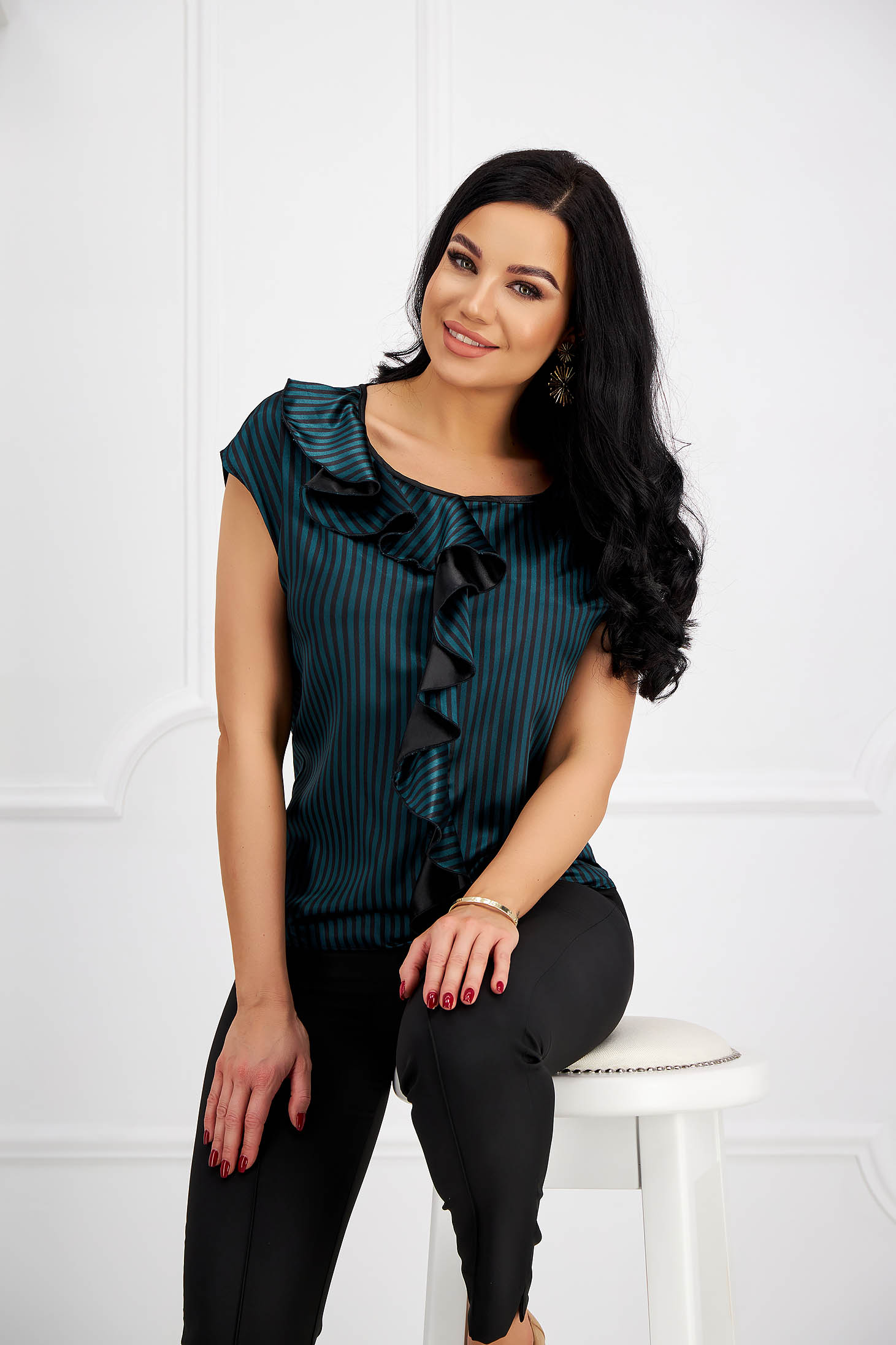 Green women`s blouse from satin fabric texture with ruffle details ...